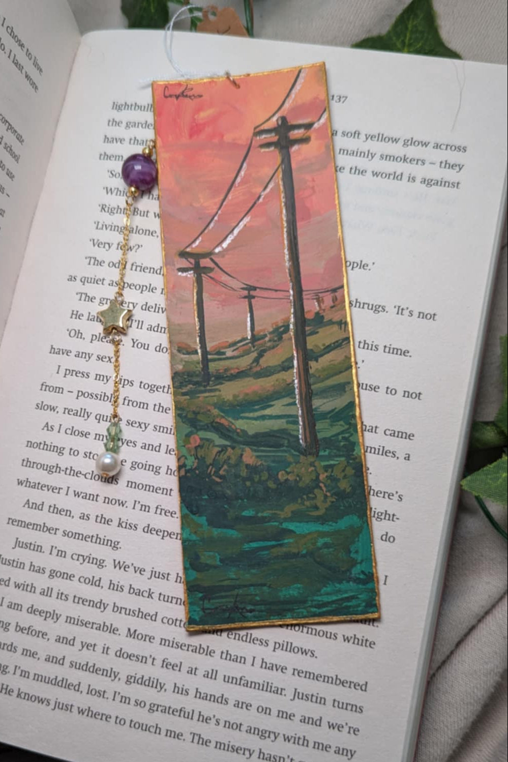 Artistic bookmark with a scenic design on an open book